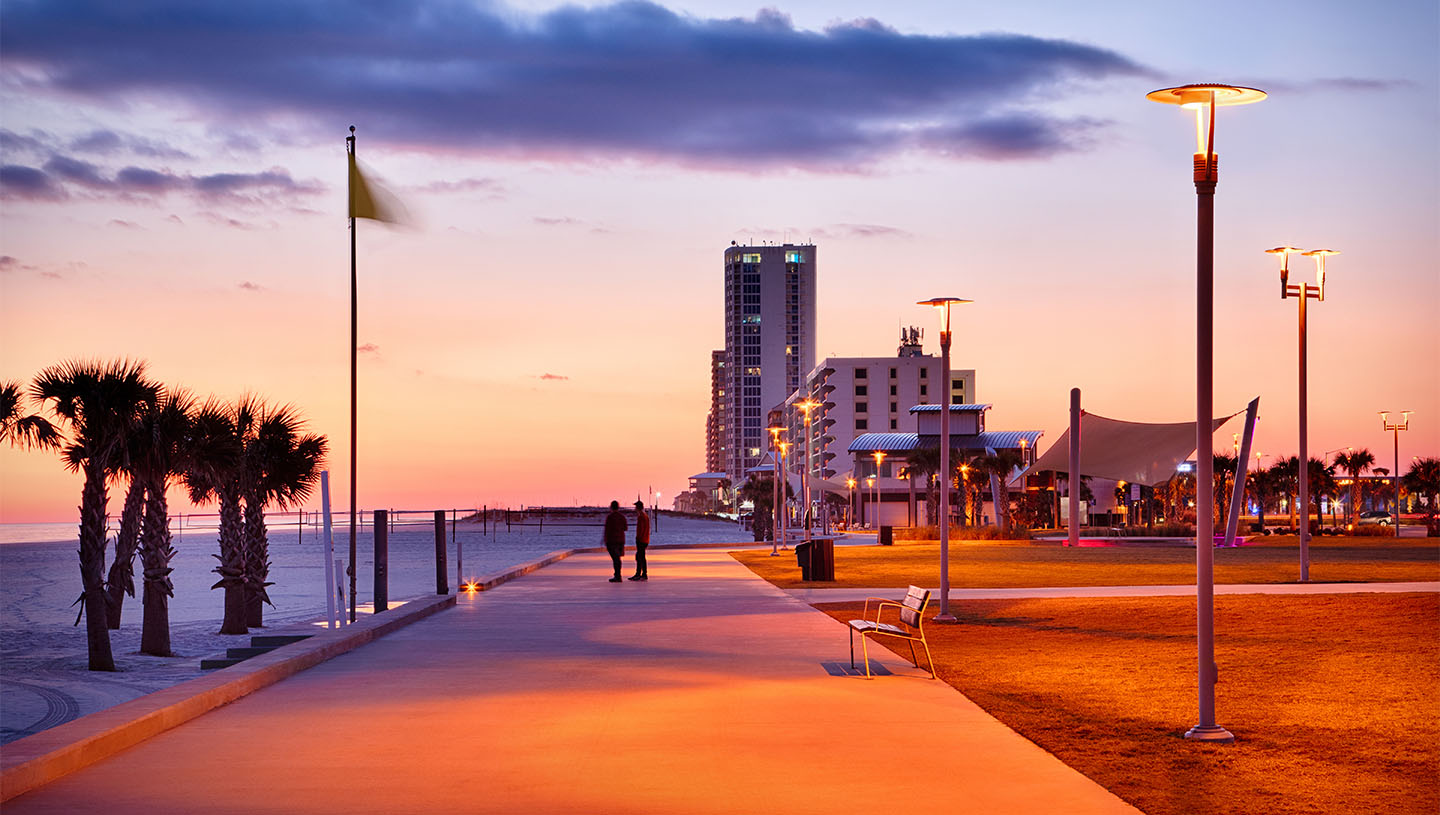 Maya lights Gulf Shores walking area at sunset